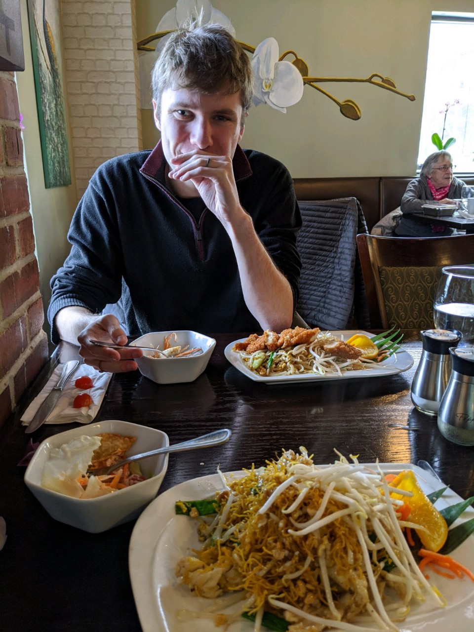 headshot of the author Erik Brobst, enjoying Thai food